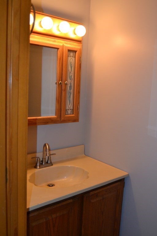 61 Monson Road Wales, MA 01081 - Photo 35 of 41 a bathroom with a sink and a mirror