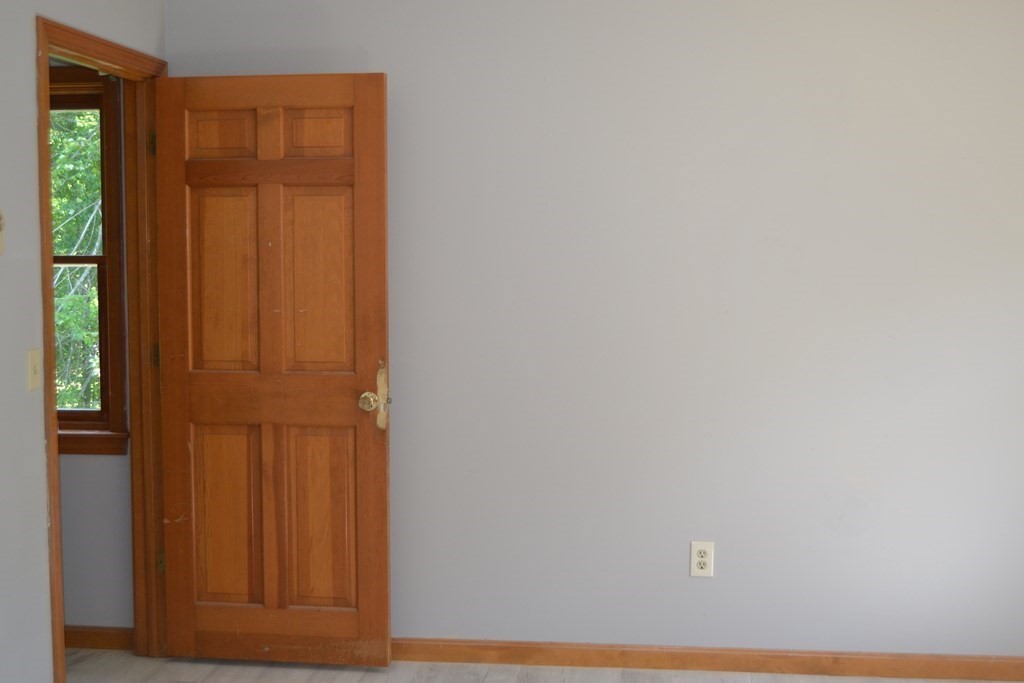 61 Monson Road Wales, MA 01081 - Photo 38 of 41 an empty room with wooden door