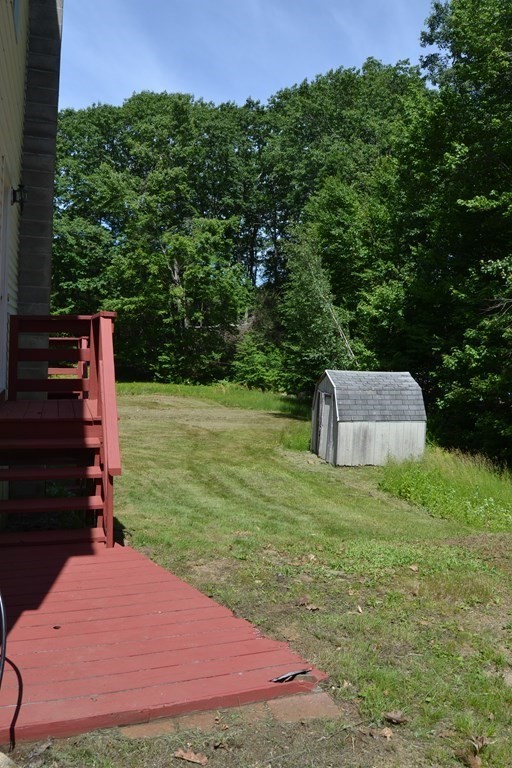61 Monson Road Wales, MA 01081 - Photo 4 of 41 a backyard of a house with lots of green space