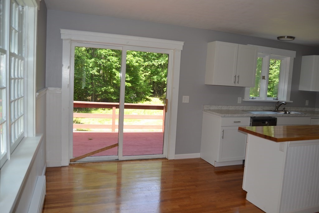 61 Monson Road Wales, MA 01081 - Photo 8 of 41 a kitchen with a sink a stove and a window