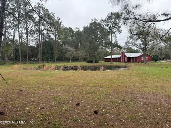 a view of a playground with a yard