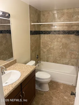 a bathroom with a sink a toilet and a bathtub