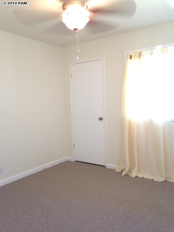 480 Kenolio Road, Unit 13204 Kihei, HI 96753 - Photo 9 of 18 an empty room with a empty space and a window