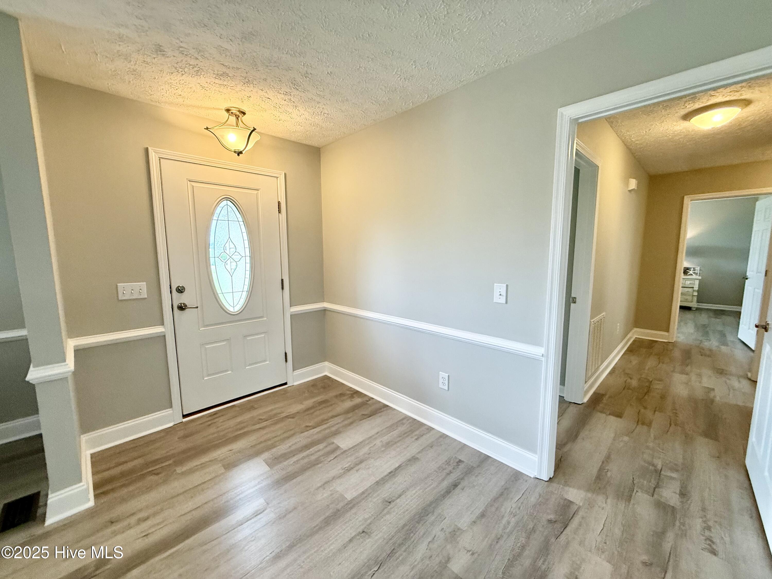 119 Cowpen Neck Road Edenton, NC 27932 - Photo 16 of 39 Back thru the dining room you will find the front door foyer and hallway leading to the bedrooms...
