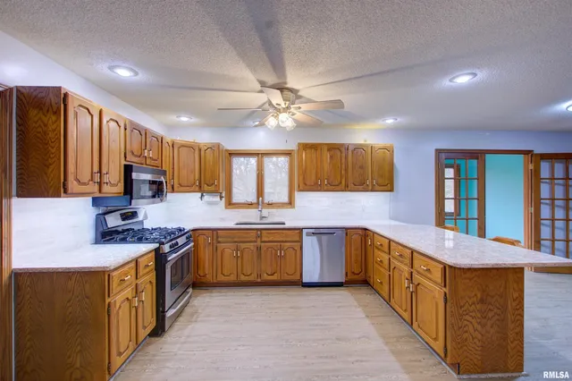 $300,000 | 591 Breezy Point Drive, Clinton, IA 52732