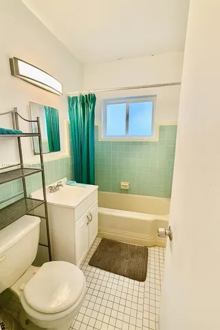 a bathroom with a toilet and a bathtub