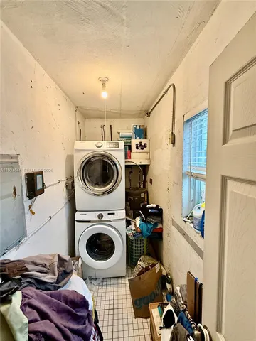 a view of a storage & utility room with washer and dryer