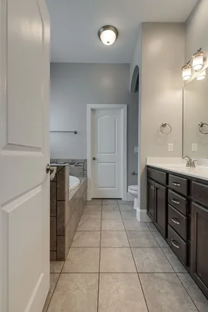 a kitchen with a sink and a refrigerator