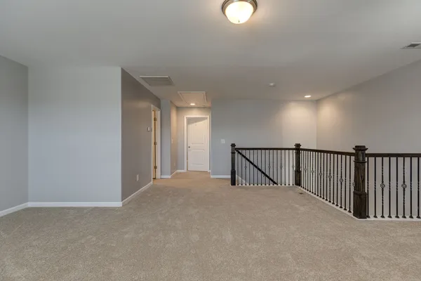 a view of staircase with lots of white walls