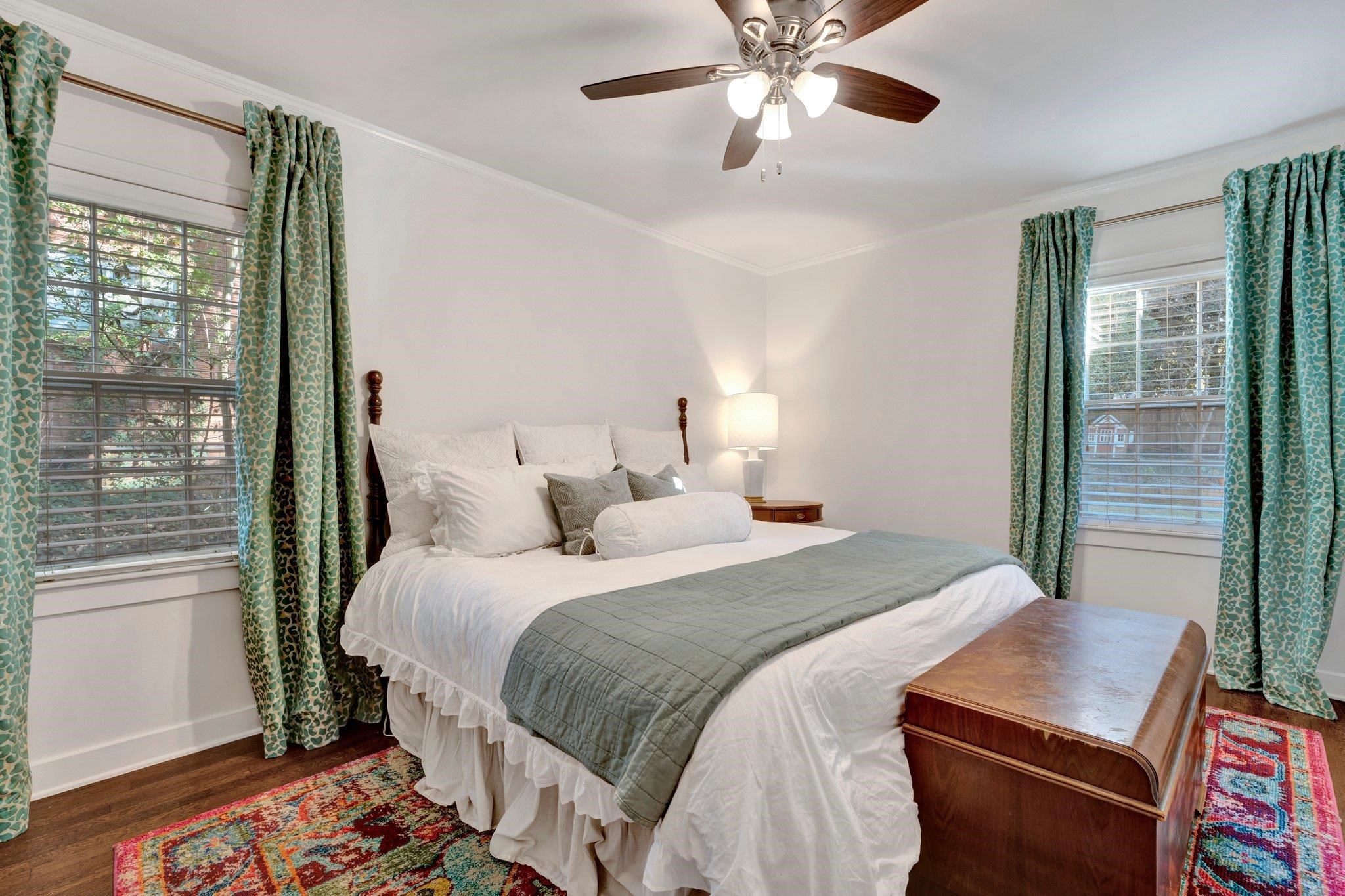 5307 Collingwood Road Memphis, TN 38117 - Photo 31 of 40 a bedroom with bed and wooden floor