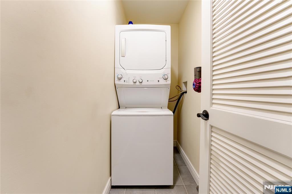 210 Hackensack Street Wood-Ridge, NJ 07075 - Photo 15 of 15 a utility room with dryer and washer
