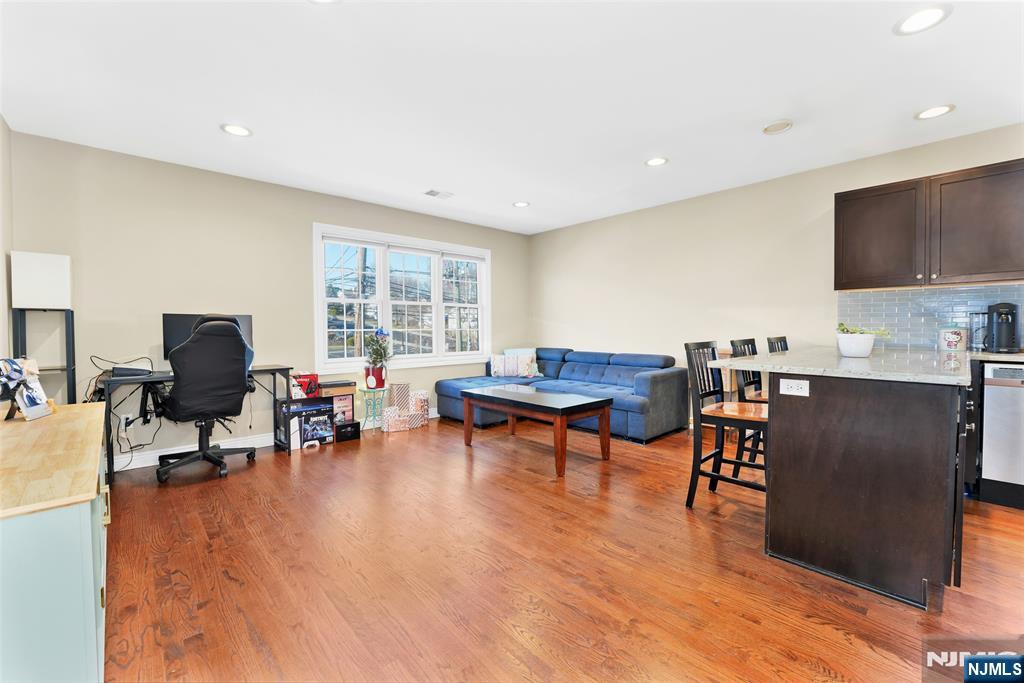 210 Hackensack Street Wood-Ridge, NJ 07075 - Photo 3 of 15 a living room with furniture and a wooden floor