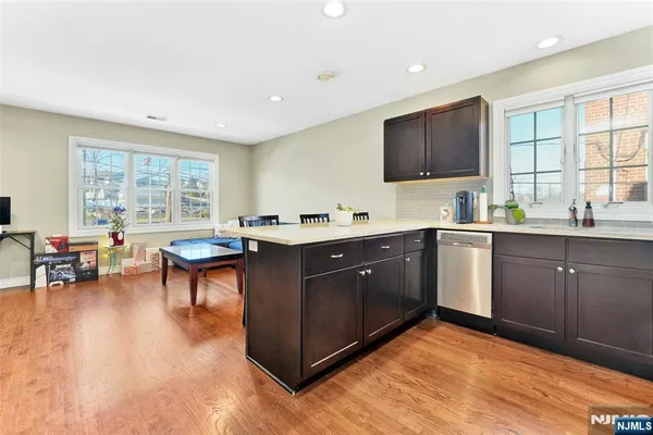 a kitchen with a sink cabinets and window