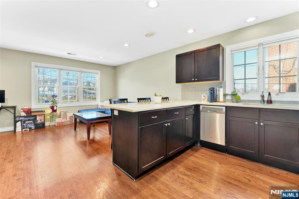 210 Hackensack Street Wood-Ridge, NJ 07075 - Photo 5 of 15 a kitchen with a sink cabinets and window