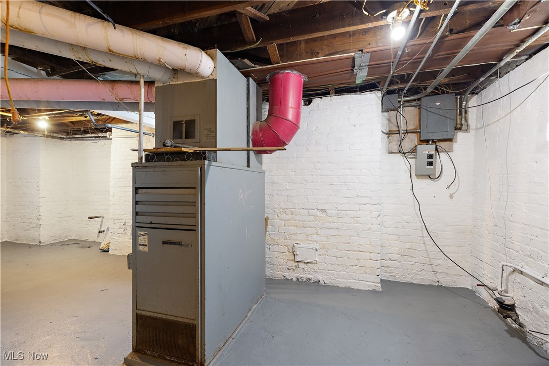 324 Root Road Lorain, OH 44052 - Photo 27 of 38 Basement with brick wall