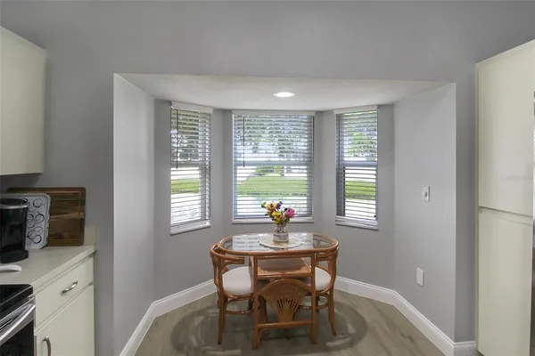 a dining room with furniture and window