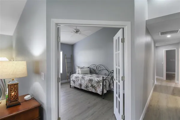 a bedroom with furniture and a window