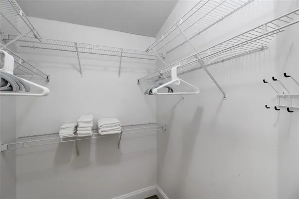 a bathroom with a shower sink and mirror