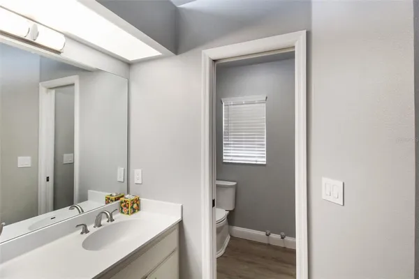 a bed room with a bed and a lamp