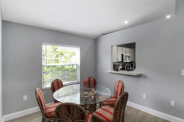 a dining room with furniture and window