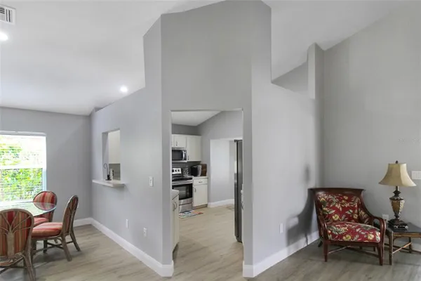 a view of a livingroom with furniture and a window
