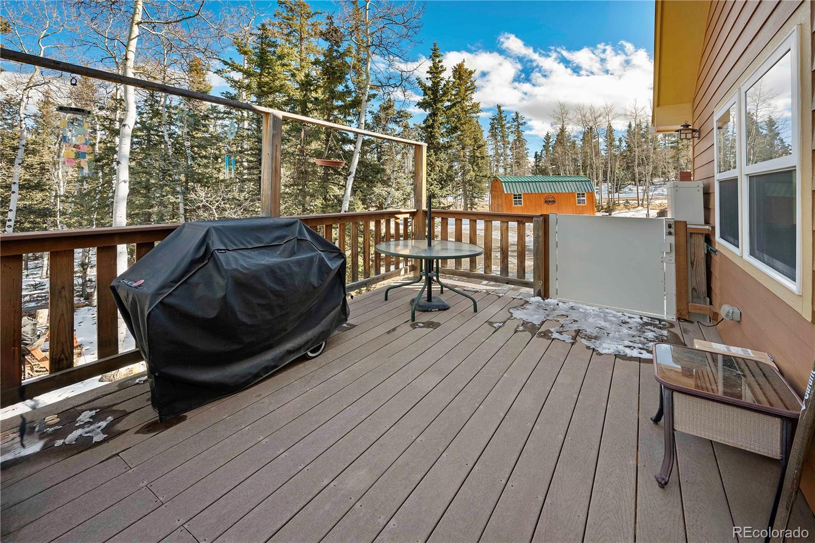 47 Piute Way Como, CO 80432 - Photo 17 of 50 a view of a balcony with wooden floor and outdoor seating