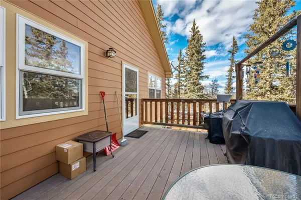 a view of a deck with couches table and chairs