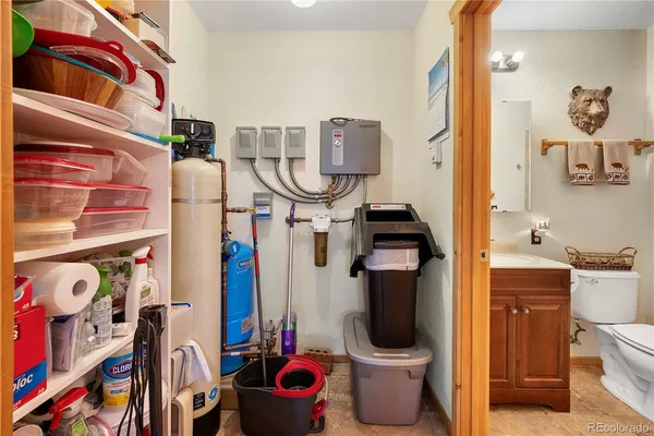 a kitchen with a sink window and cabinets