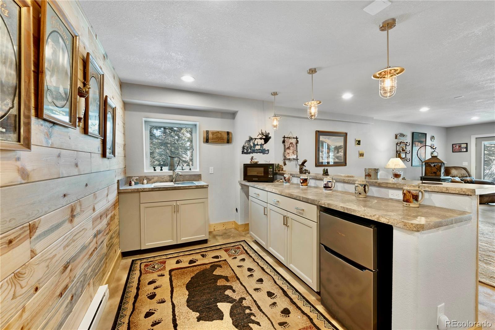 47 Piute Way Como, CO 80432 - Photo 37 of 50 a kitchen with a sink window and cabinets