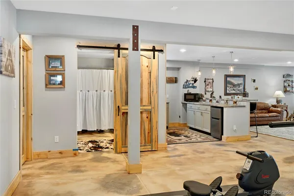 a bathroom with a double vanity sink mirror and toilet