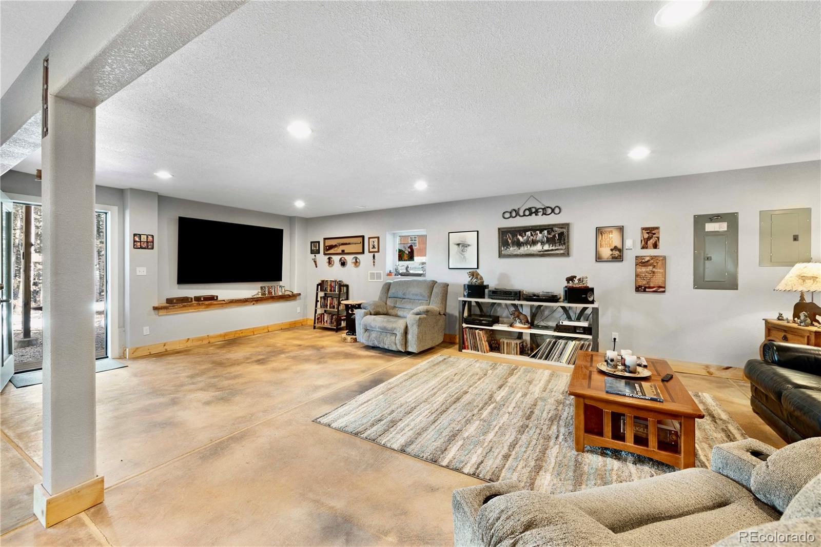 47 Piute Way Como, CO 80432 - Photo 43 of 50 a living room with furniture and a flat screen tv