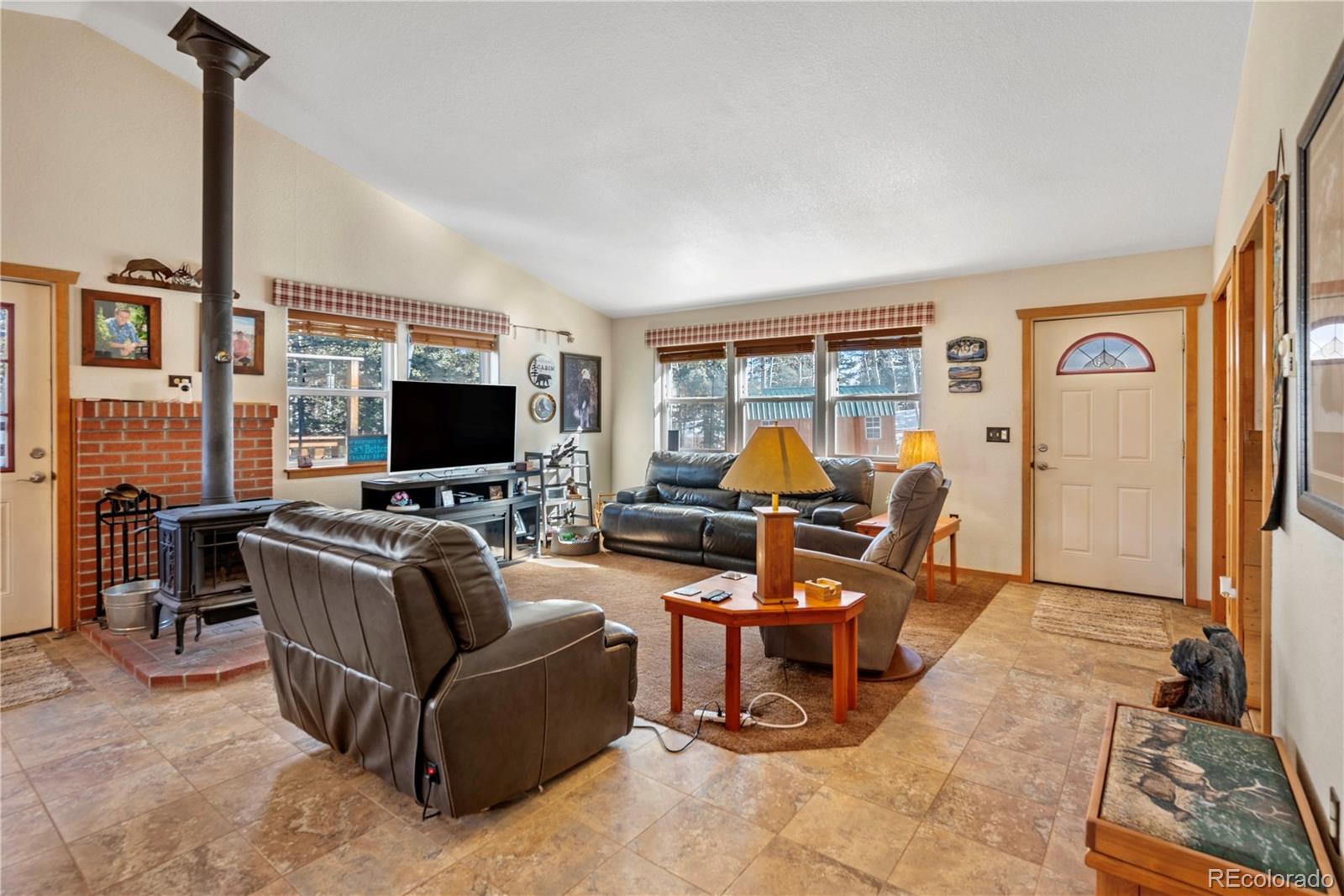 47 Piute Way Como, CO 80432 - Photo 7 of 50 a living room with furniture and a flat screen tv