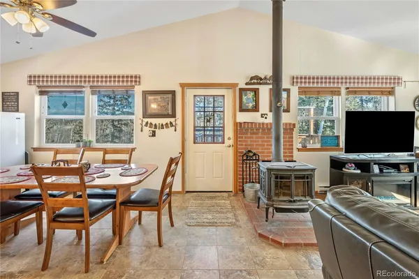 a view of a livingroom with furniture window and outside view
