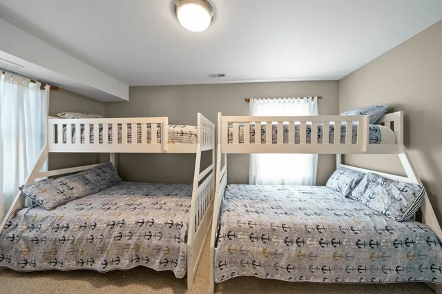a bathroom with a sink mirror vanity and toilet