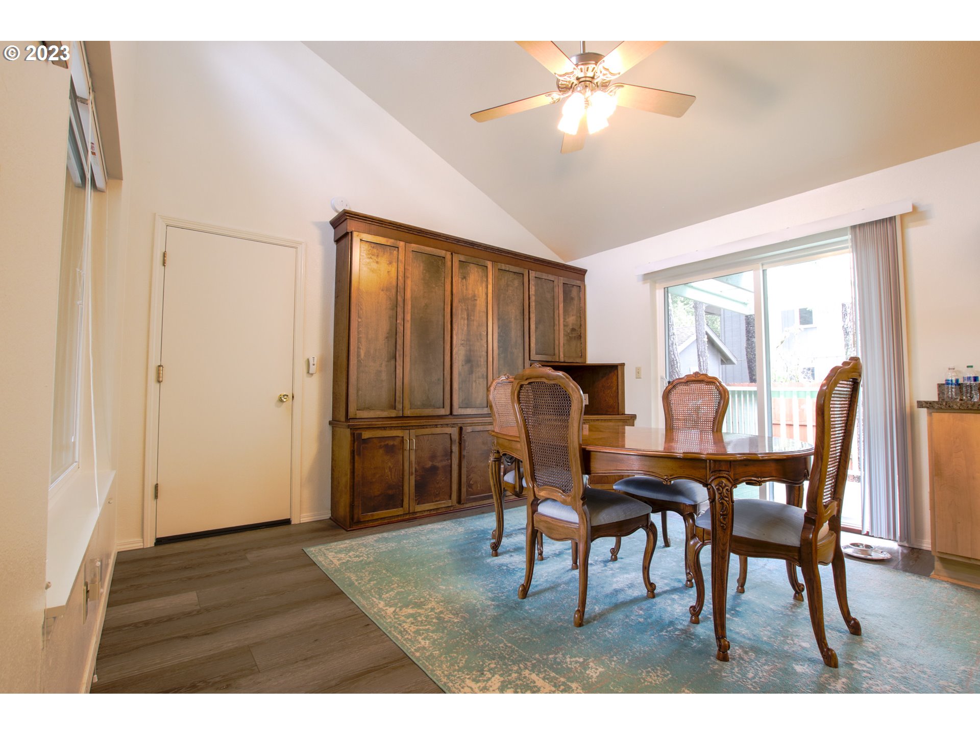 2240 23rd Street Florence, OR 97439 - Photo 20 of 37 a view of a dining room with furniture and chandelier