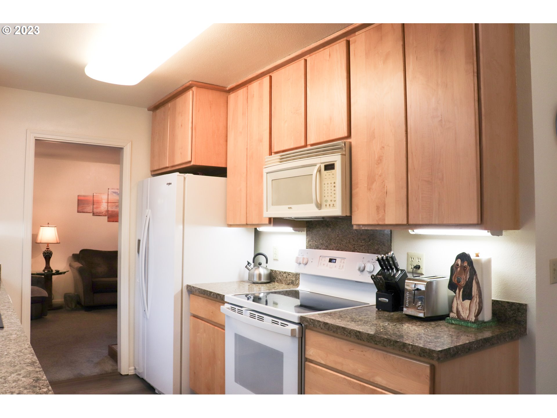 2240 23rd Street Florence, OR 97439 - Photo 25 of 37 a kitchen with stainless steel appliances granite countertop a refrigerator sink and cabinets