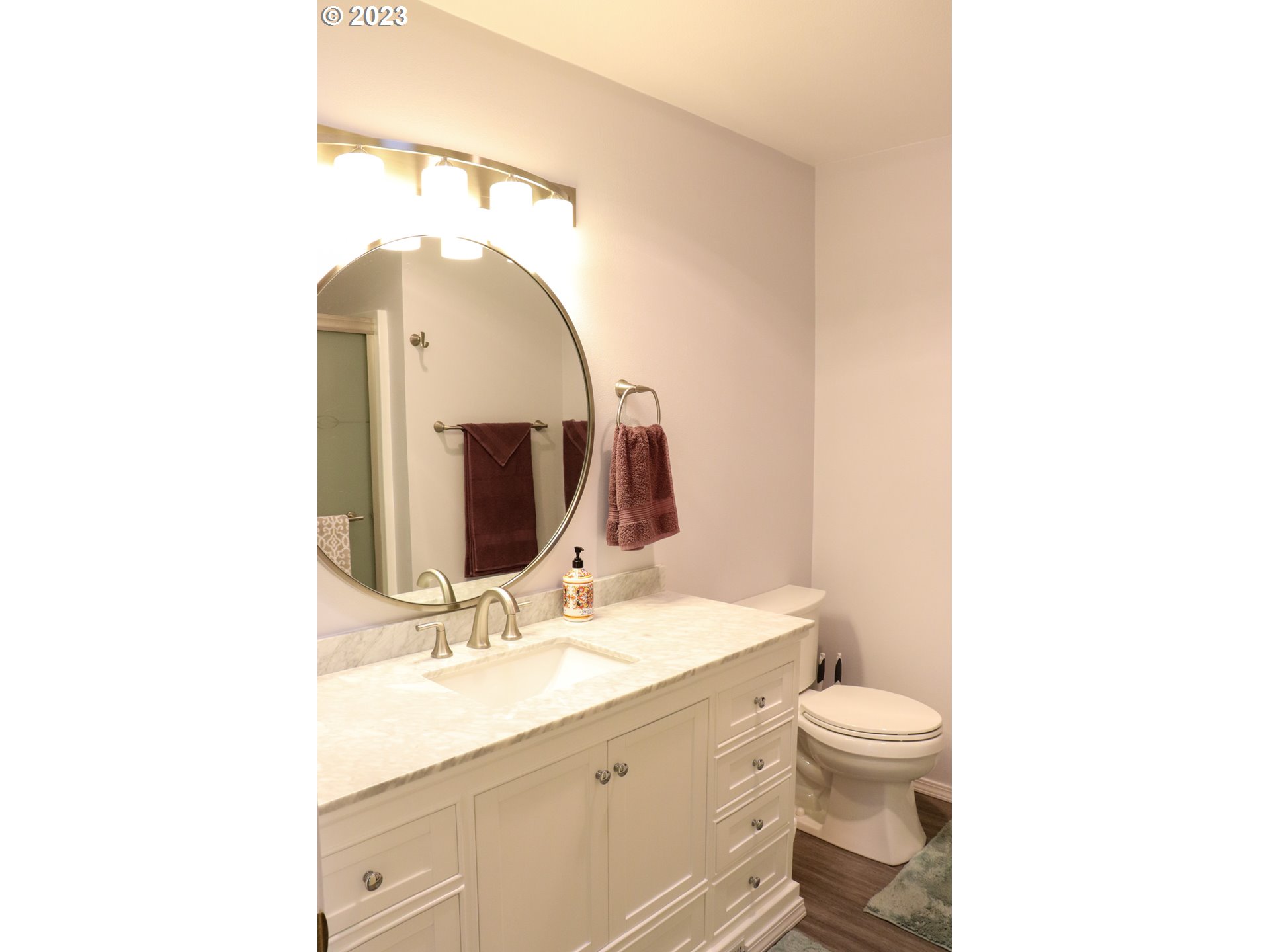 2240 23rd Street Florence, OR 97439 - Photo 28 of 37 a bathroom with a toilet sink and mirror