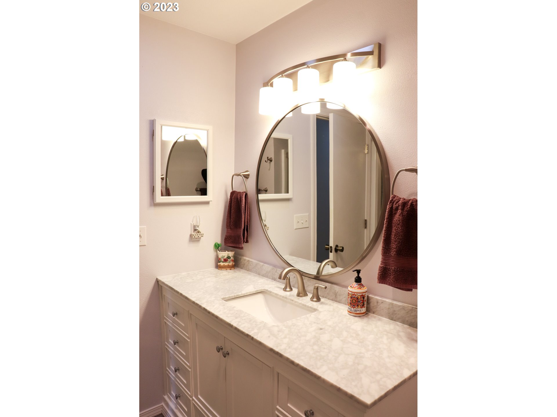 2240 23rd Street Florence, OR 97439 - Photo 29 of 37 a bathroom with a sink and a mirror