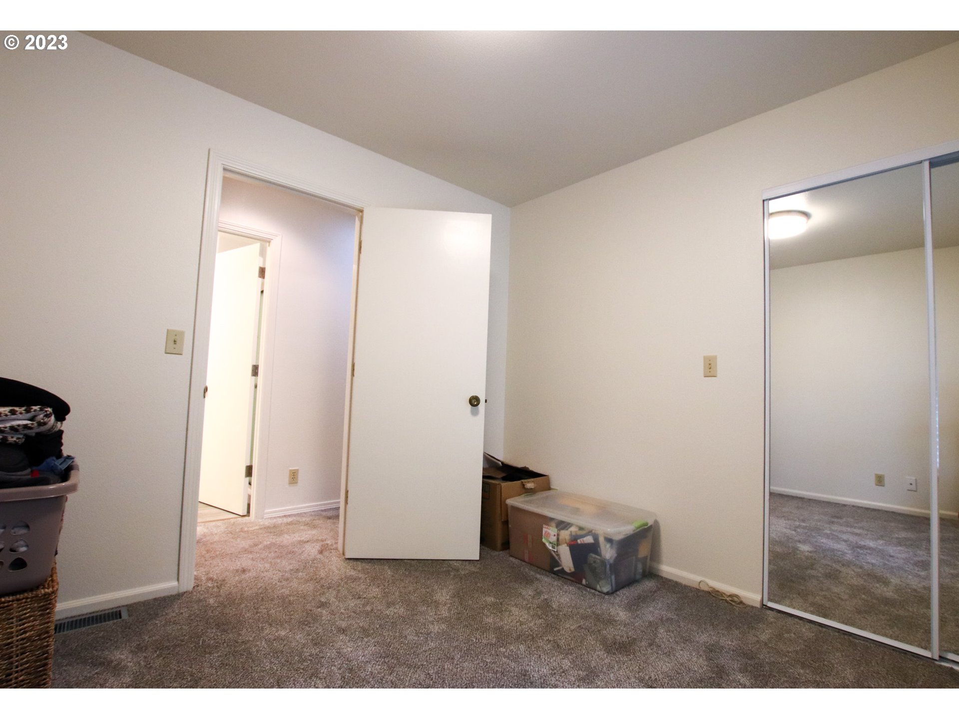 2240 23rd Street Florence, OR 97439 - Photo 35 of 37 an empty room with closet and mirrors
