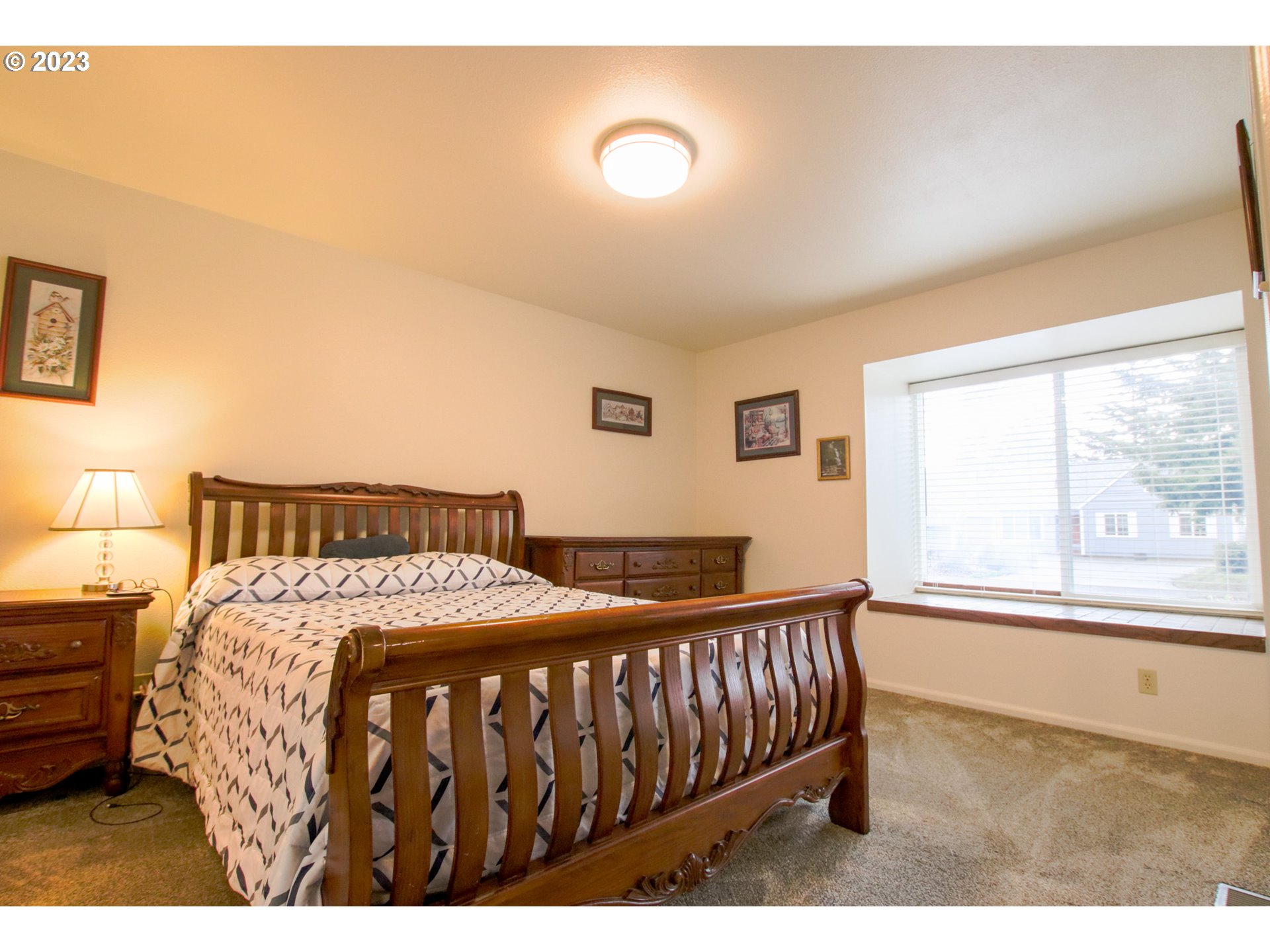 2240 23rd Street Florence, OR 97439 - Photo 36 of 37 a bedroom with a bed and a window