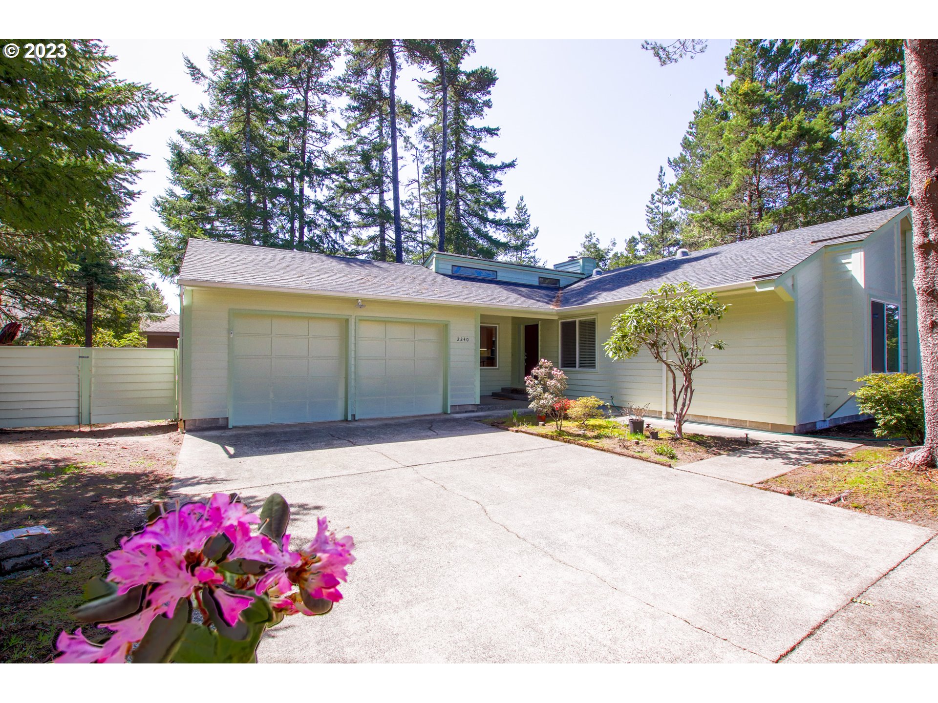 2240 23rd Street Florence, OR 97439 - Photo 5 of 37 a view of a backyard with a garage