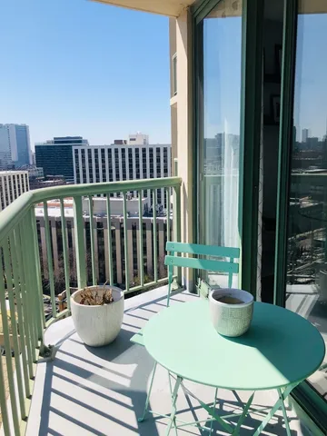 a view of balcony with furniture