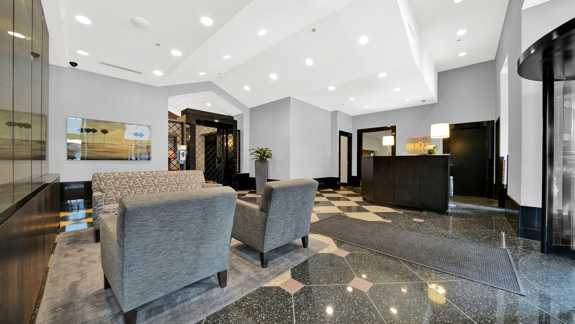 111 West Maple Street, Unit 1309 Chicago, IL 60610 - Photo 4 of 14 a living room with furniture a flat screen tv and a refrigerator