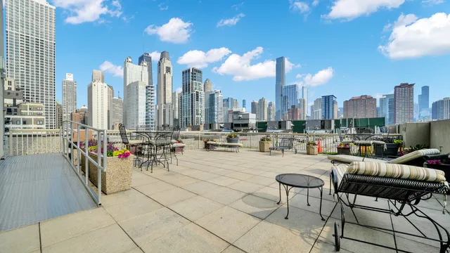 a kitchen with stainless steel appliances granite countertop white cabinets and a granite counter tops
