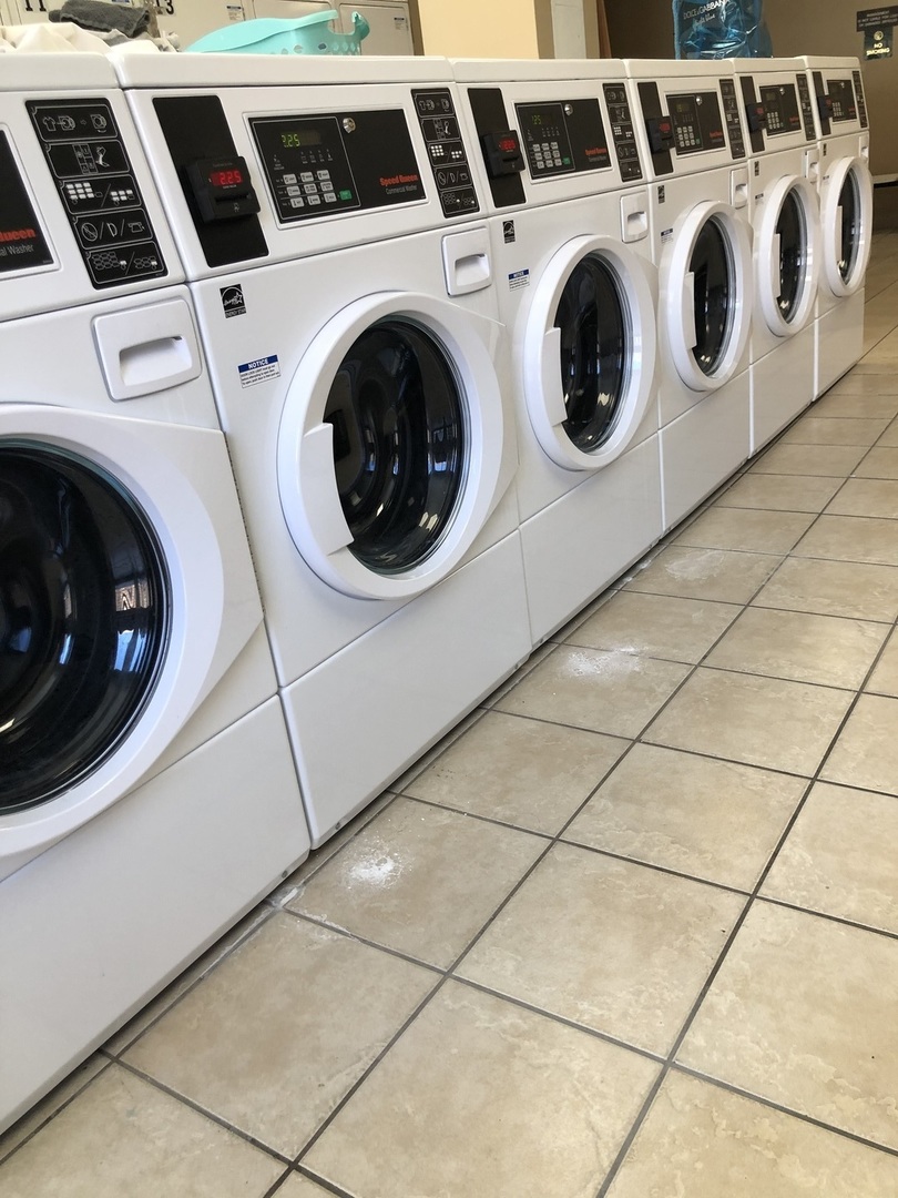 111 West Maple Street, Unit 1309 Chicago, IL 60610 - Photo 8 of 14 a utility room with dryer and washer