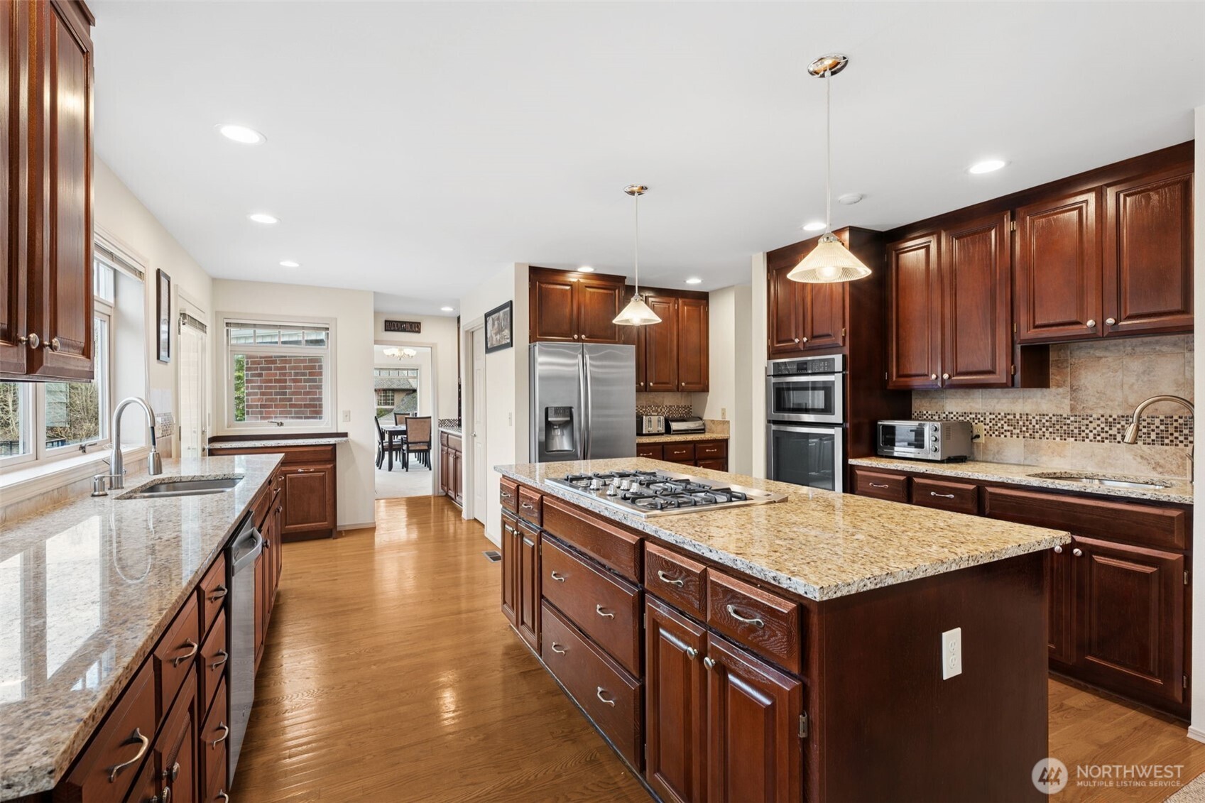 19301 4th Place Southwest Normandy Park, WA 98166 - Photo 13 of 37 a kitchen with a stove sink and cabinets