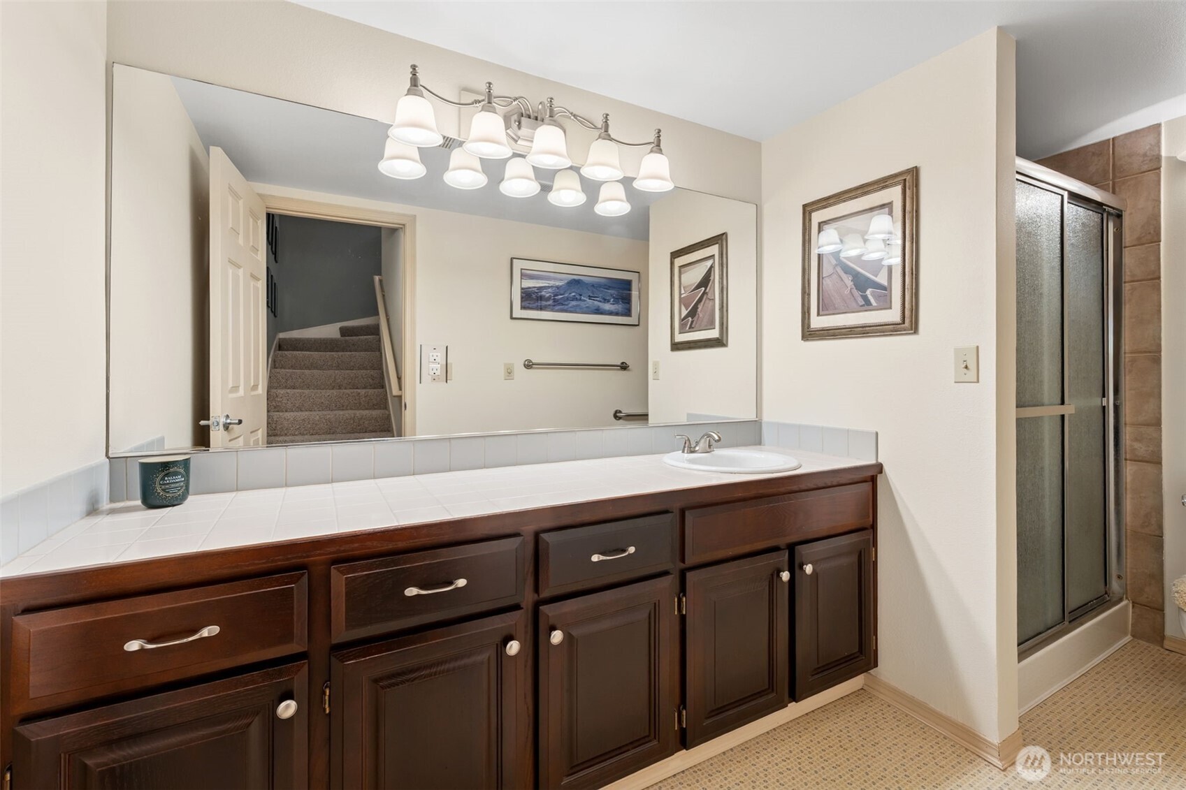 19301 4th Place Southwest Normandy Park, WA 98166 - Photo 14 of 37 a bathroom with double vanity sink a vanity and a large mirror