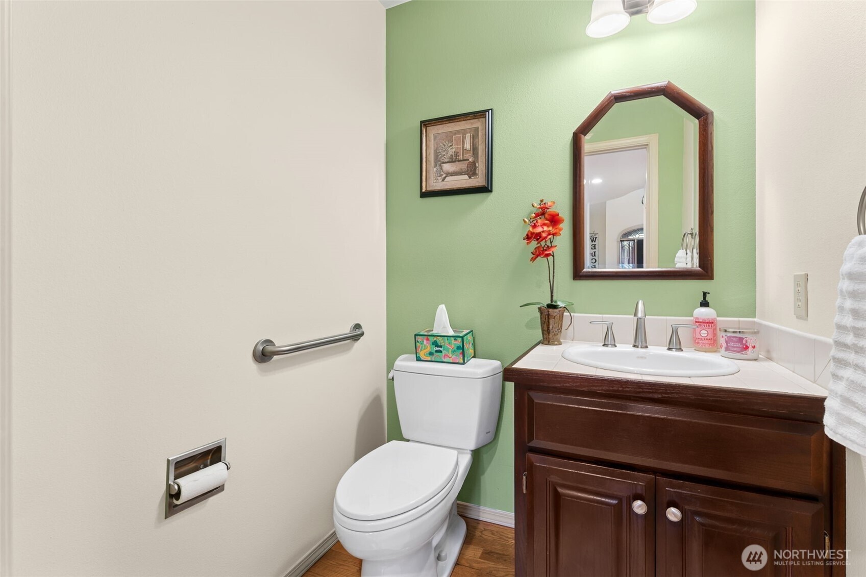 19301 4th Place Southwest Normandy Park, WA 98166 - Photo 18 of 37 a bathroom with a toilet a sink and mirror