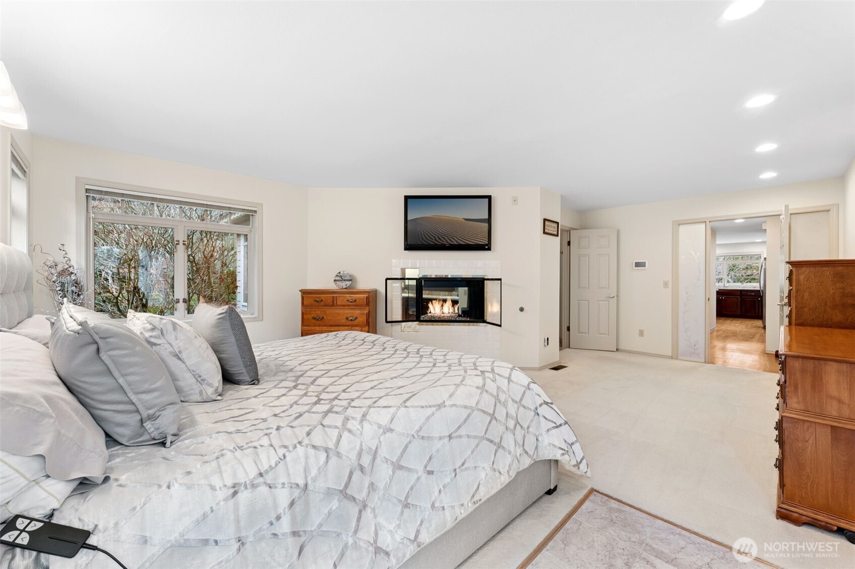 19301 4th Place Southwest Normandy Park, WA 98166 - Photo 19 of 40 a large bedroom with a bed and a flat screen tv