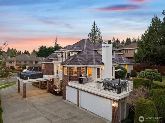 an aerial view of a house with garden space and street view